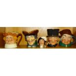 A collection of four large Royal Doulton character jugs, 'John Peel', 'Dick Turpin', 'Uncle Tom