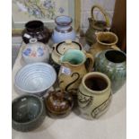 A collection of various studio pottery, including two jugs and a vase by William Fishley Holland,