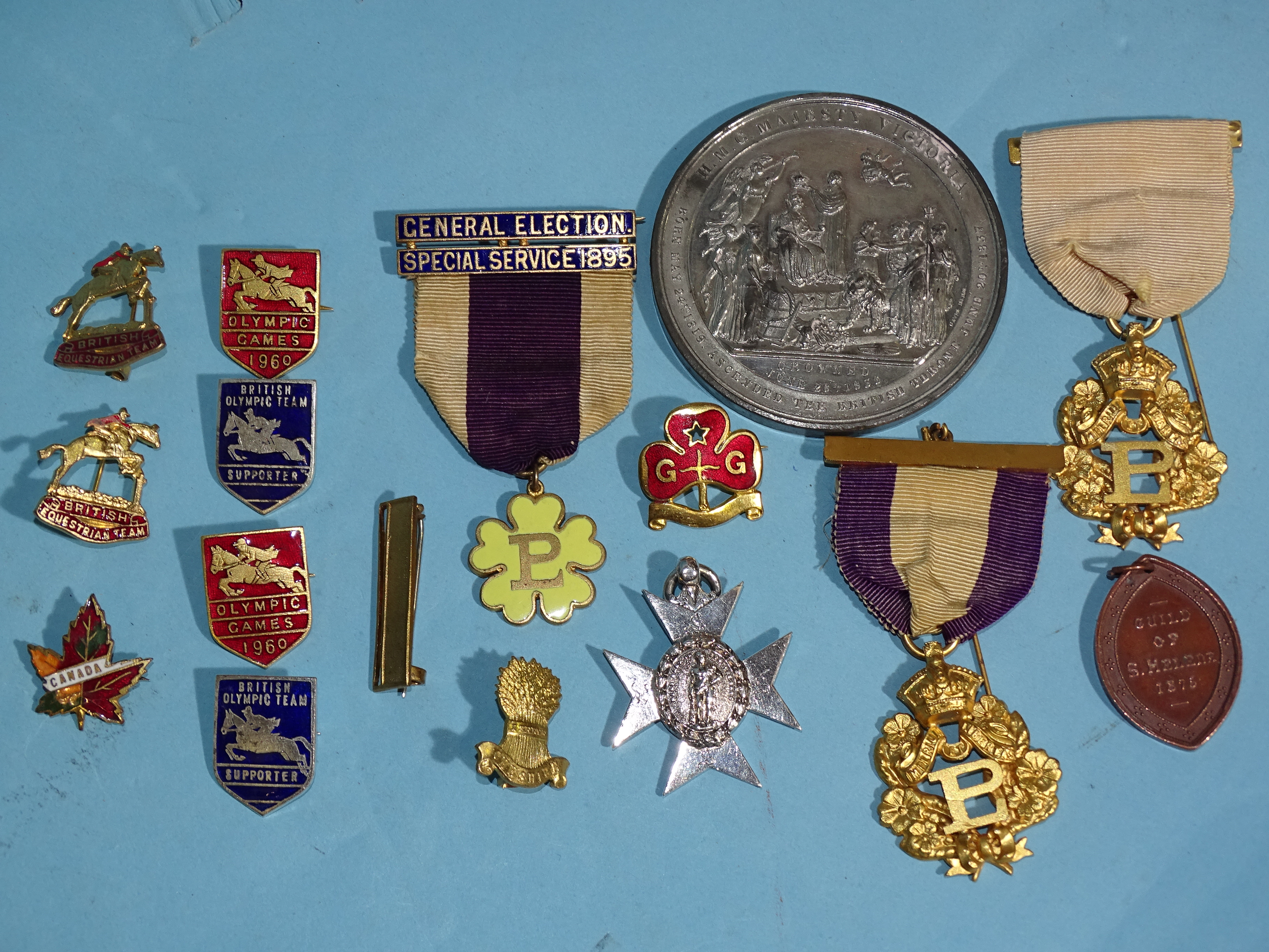 A small collection of badges, including two pre-1960 Olympic Games British Equestrian Team badges,