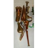 A copper slipper ale warmer, a copper ale mull, a powder flask and other metal items.