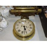 A ship's brass bulkhead clock, 24cm and a brass theodolite by J Hadden & Co, Manchester and