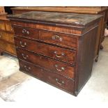 A Georgian chest on chest, the top section of two short and three long drawers, within fluted