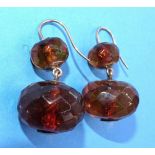 A pair of Victorian amber drop earrings, each set two faceted amber beads, on gold fittings, 35mm