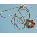 A 9ct gold wreath pendant set six round-cut rubies, on 9ct gold chain, 45cm, 4.4g.
