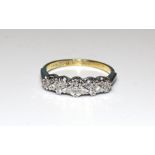 A five-stone diamond ring illusion-set 8/8-cut diamonds, in 18ct gold mount, size P, 3.5g.