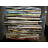 A collection of various LP and 45RPM records.