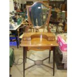 An Edwardian gentleman's mahogany shaving stand, the superstructure fitted with a shield-shaped