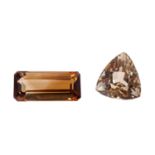 2 braune Topase von ca. 28,7 ct.,