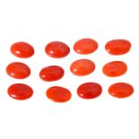 Konvolut von 12 Korallencabochons von zus. ca. 37,9 ct,