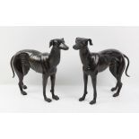 Pair of cast bronze figures of a male and female greyhound, each, approx. 29cm high x 38cm long