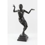 Modern Art Deco style bronze casting of a dancer with her arms outstretched and knees bent,