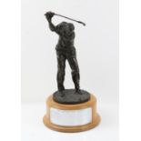 Cast bronze figure of a golfer, H29cm, mounted on a turned wood presentation plinth,