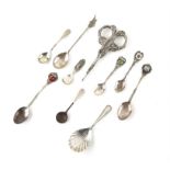 Shell bowl silver caddy spoon, a selection of continental silver spoons in various grades and a