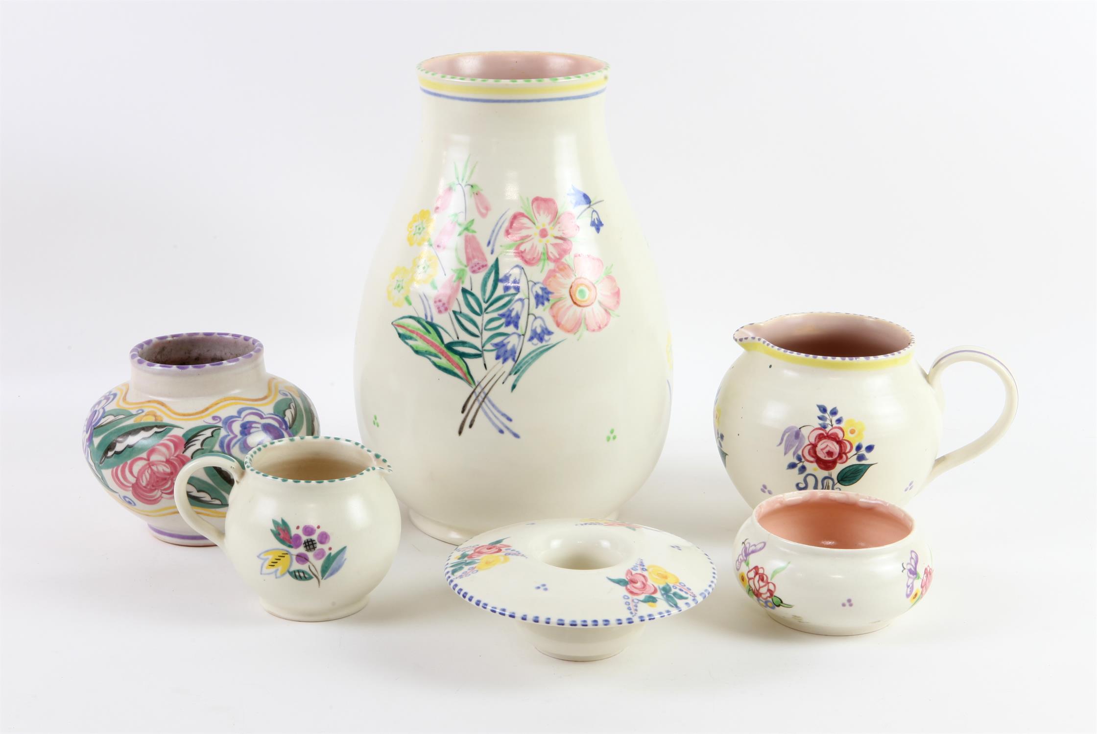 Poole Pottery vase decorated with flowers, 25cm high, two jugs and three smaller vases all with