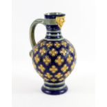 Minton Majolica blue ground vase with mask spout, restored. 28cm high