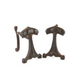 Pair of cast iron fire dogs in the style of Voysey H20cm