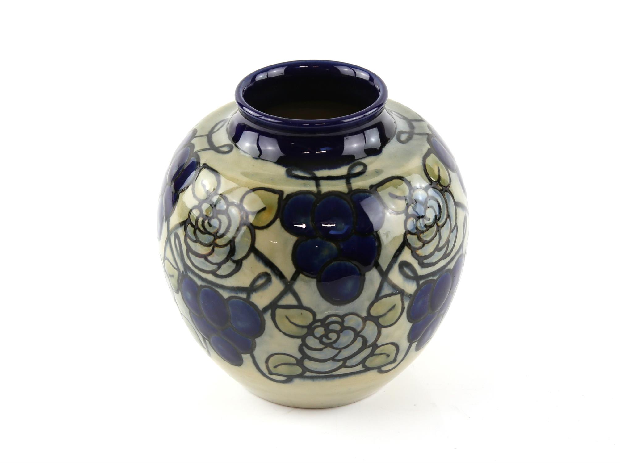 Royal Doulton stoneware vase, glazed with blue grape and rose decoration, 14.5 cm high