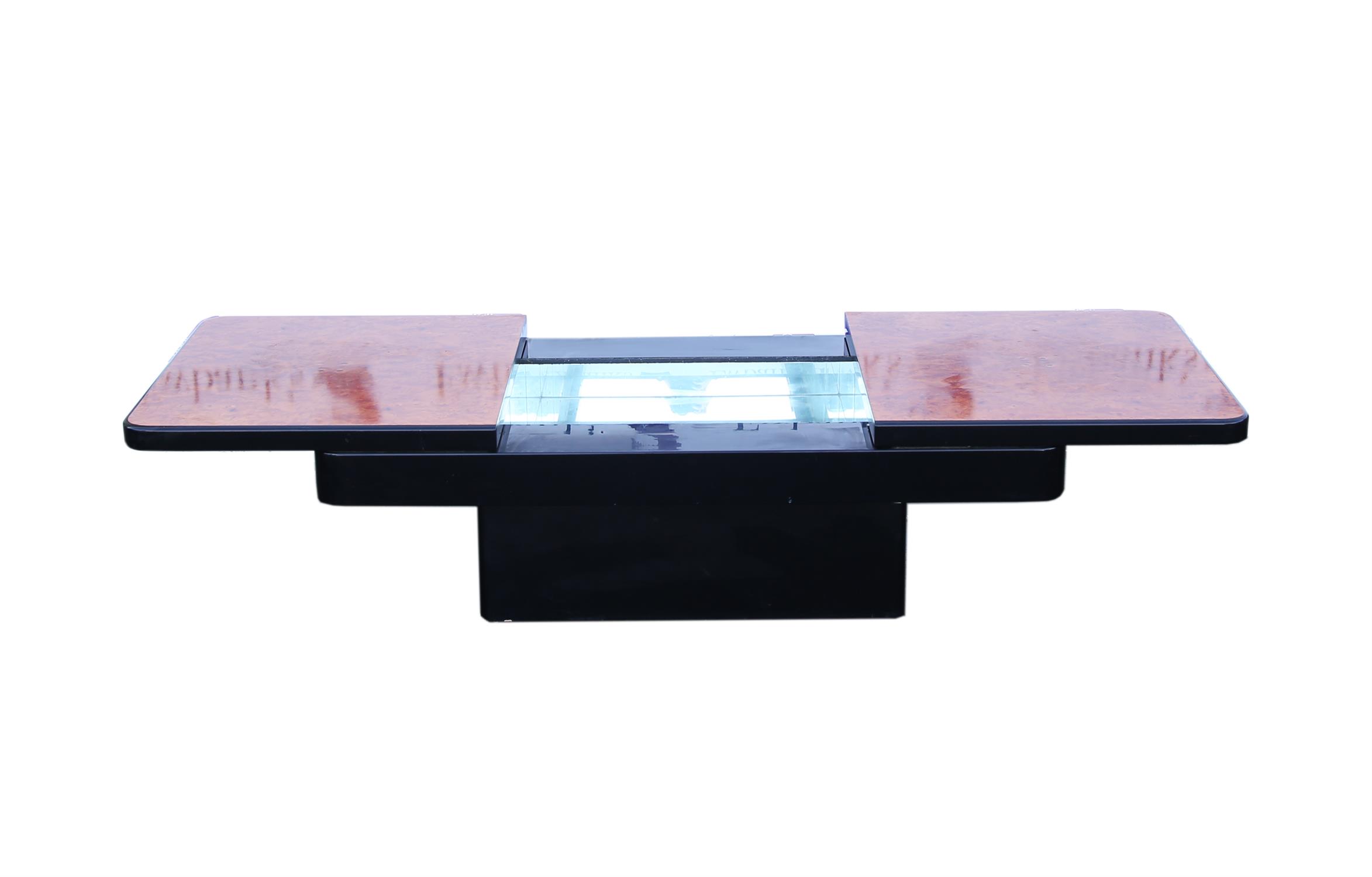 Amboyna and ebonised coffee table, the sliding rectangular top enclosing a mirrored interior, H41,