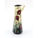 Moorcroft Pottery tall jug, with red flowers, signed by Sian Leeper for MDS, dated 2001, 24 cm high