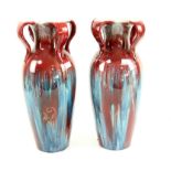 Pair of red and blue streaked glaze vases, each with four handles to the neck, traces of gilded
