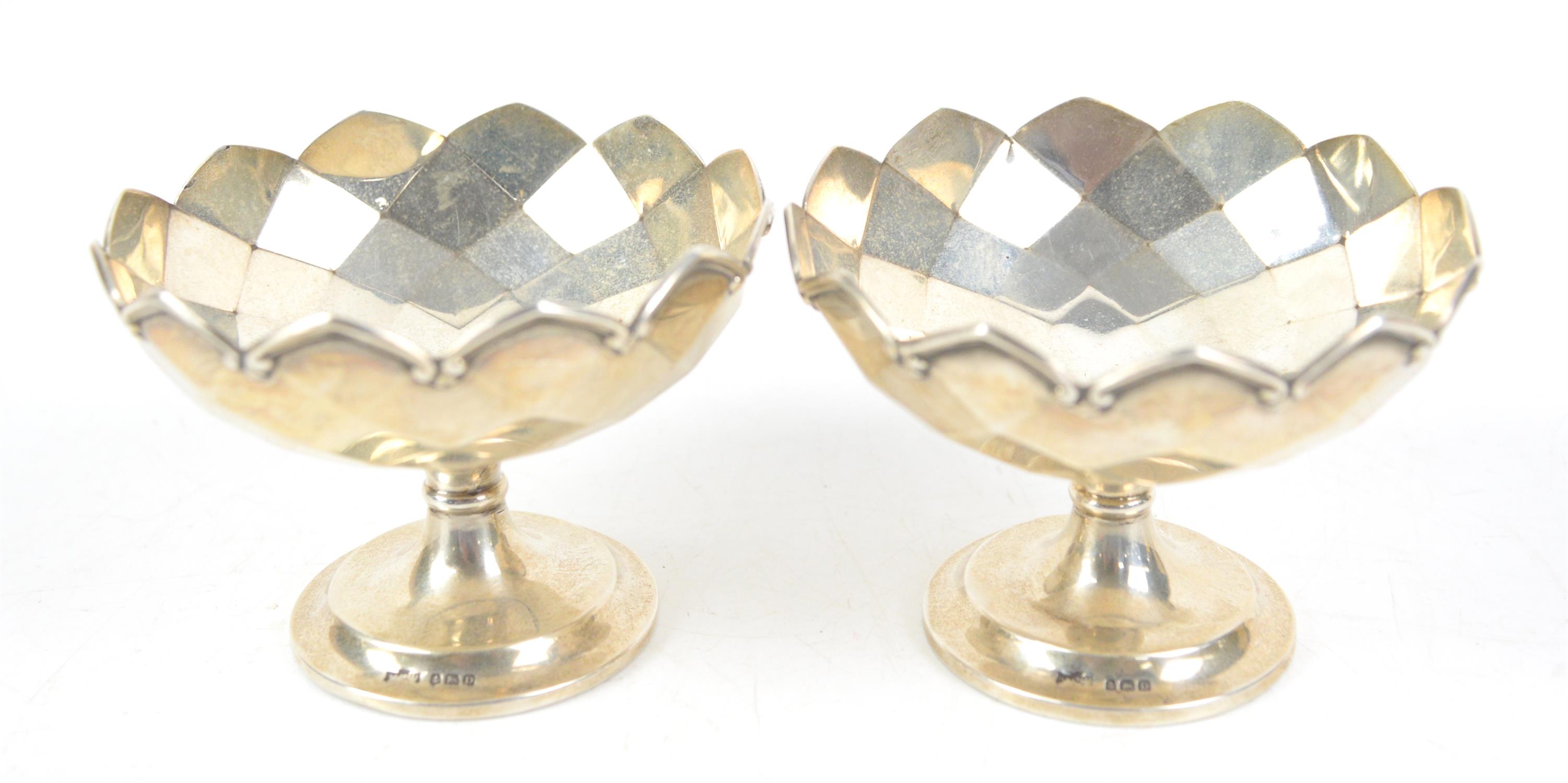 Pair of pedestal silver bon bon dishes with a swirled geometric inner and outer pattern 230 grams