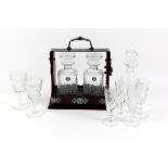 Stuart Crystal two decanter tantalus, six Edinburgh Crystal wine glasses, and an associated