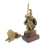 Brass figure of Britannia, on a mahogany base, 19 cm high, and a gilt metal figure of a lion (2)