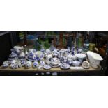 Collection of Delft china ornaments and plates, including clogs, windmills, pigs etc.
