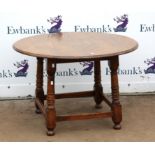 Circular oak table on turned supports, stretchered base and bun feet, h65cm, 99cm diameter,