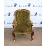 Victorian gentleman's button back armchair, with scroll and floral carved arms, above cabriole legs