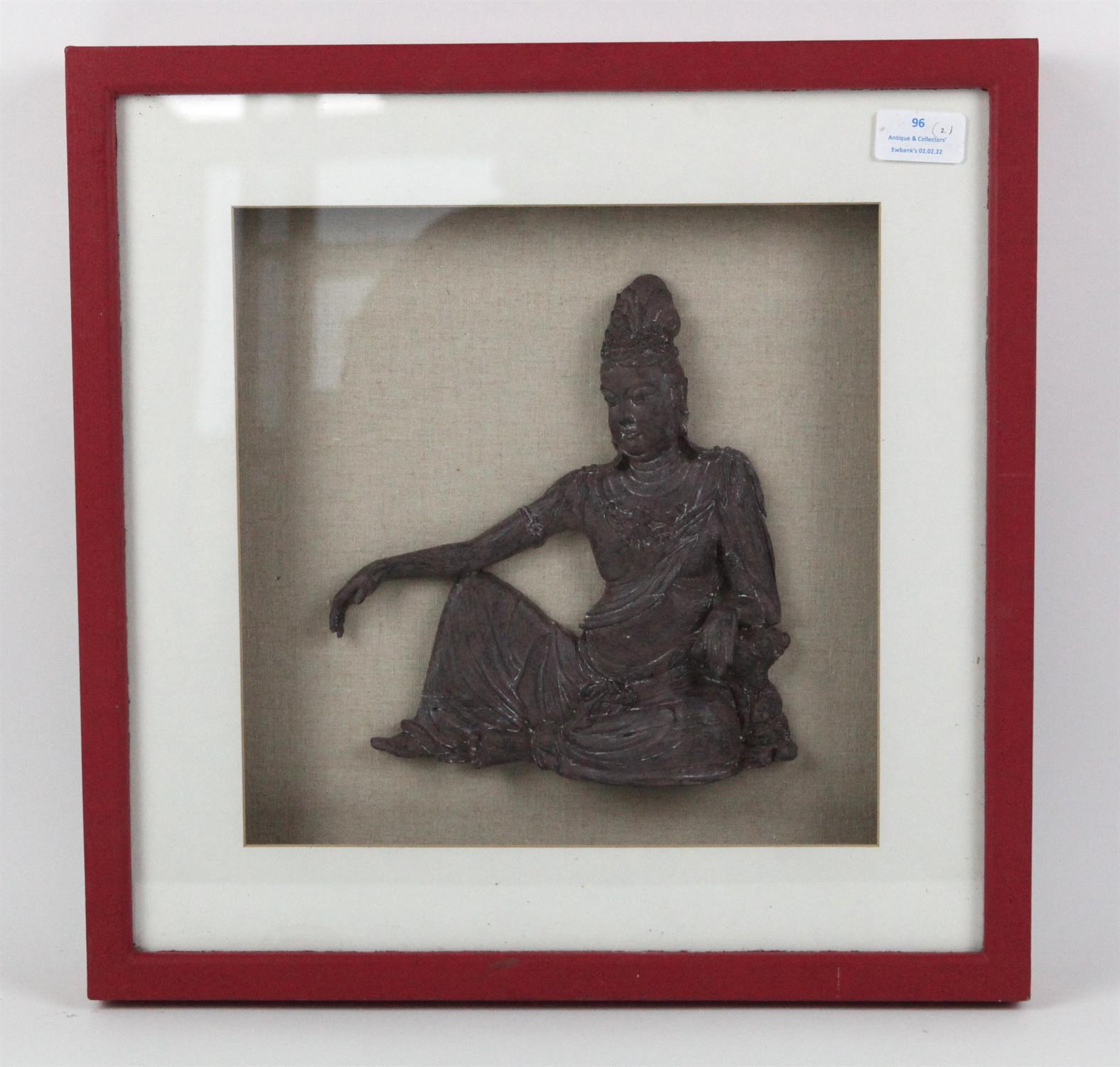 Thai seated figure wall mount, later framed, believed to be bronze, frame 41.5 cm square,