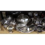 Two three piece silver plated tea services, two oval tureens and covers, a helmet shaped sugar