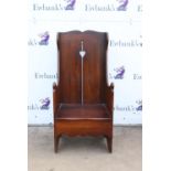 Stained oak armchair with pierced heart decoration,