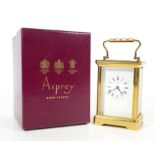 Brass carriage clock retailed by Asprey, the white enamel face with black roman numerals, 15cm,