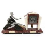 Art Deco pink and white mantel clock, with a silvered figure of a lady, the square dial inscribed