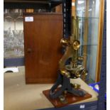 Monocular brass microscope, inscribed H. Hughes & Son, 59 Fenchurch St, London, 33 cm high,