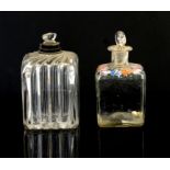 Two glass scent bottles, one with silver collar and swirl form glass, the other with painted floral