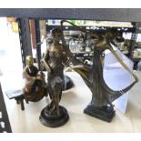 Two cast metal figures of Art Deco women, Native American, and oriental figure on a bench.