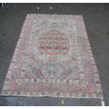 Pair of Indian Paisley design rugs, with central palm leaf medallions, and foliate borders,
