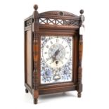 Victorian mahogany mantel clock, the porcelain face decorated with an urn and sunflowers,