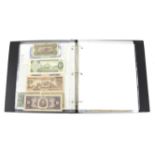 Banknote album containing a quantity of banknotes from all over the world