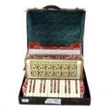 Milani accordion, in pink with two octave keyboard, cased