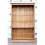 Pine open bookcase, with moulded cornice, adjustable shelves and plinth base, H197 W126 D29