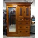 Early 20th century walnut wardrobe with mirrored door, panelled cupboard over two short and three