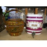 Chinese softwood rice carrier, with gilt decoration, 33cm high and a pottery rum barrel with tap,
