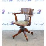 Stained beech swivel office chair, broad top rail over pierced splat and leather seat with tilt