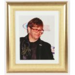 Elton John - framed photograph, Signed bottom left in gold by Elton John, with certificate of