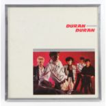 Duran Duran - Signed Album cover by Simon Le Bon and Nick Rhodes, framed 33 x 33cm.