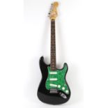 Fender Stratocaster style electric guitar with green marble effect scratch plate.