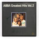 Abba - A ‘Greatest Hits Vol. 2’ album cover fully signed in green by all four band members,